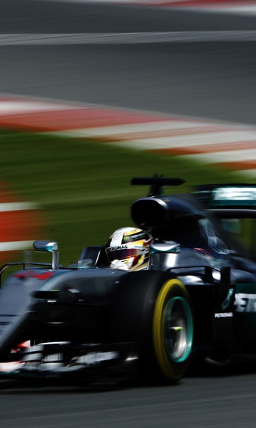 Hamilton takes pole as holds off challenges from Rosberg, Red Bull